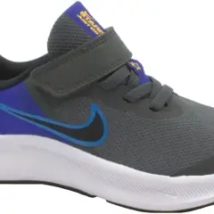Scarpa Nike grigia con dettagli blu e viola, chiusura a velcro. Perfetta per ogni avventura, che tu sia grande o piccolo.