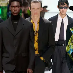 Modelli con abito nero uomo, camicia colorata e cravatta. Stili diversi per un look audace.