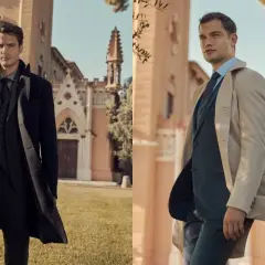 Uomo elegante con cappotto nero e completo grigio. La lunghezza cappotto uomo è perfetta per un look sofisticato.