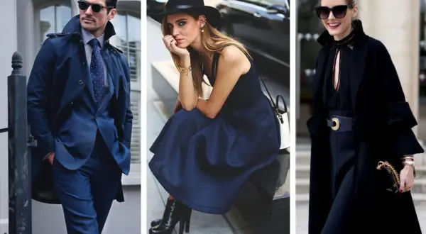 Uomo in abito blu, donna con cappello e gonna blu, donna con cappotto nero. Blu e nero stanno bene insieme, creando un look elegante e sofisticato.