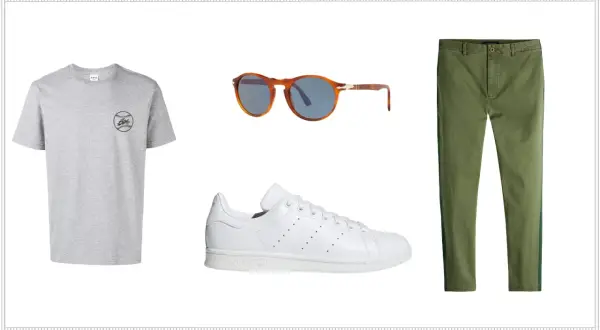 Outfit con t-shirt grigia, occhiali da sole tartarugati, pantaloni verdi e le iconiche Adidas Stan Smith, un classico intramontabile.