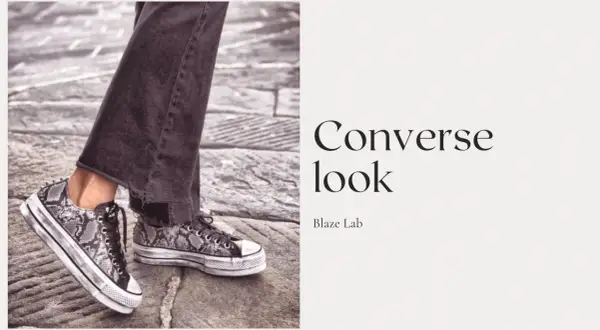 Un outfit con Converse uomo: jeans scuri e sneakers con stampa pitonata e plateau.