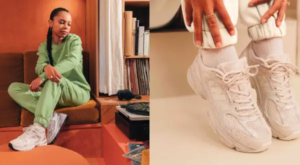 Donna con tuta verde e sneakers New Balance 530, un look casual e alla moda.