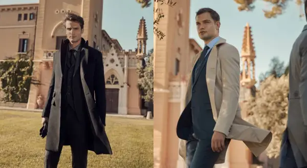 Uomo elegante con cappotto nero e completo grigio. La lunghezza cappotto uomo è perfetta per un look sofisticato.