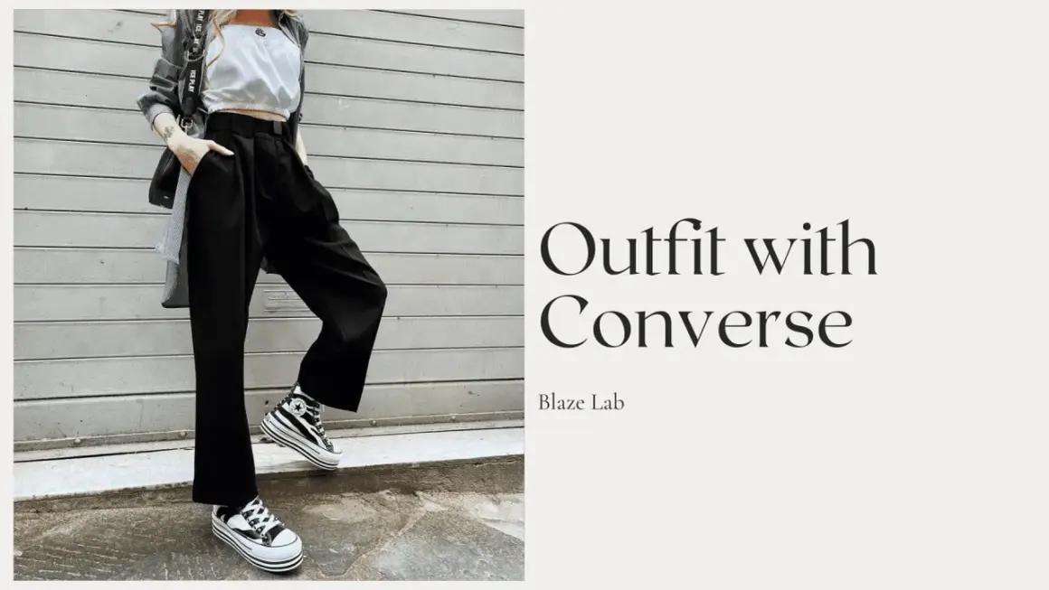 Outfit con Converse alte a righe, pantaloni neri ampi e top bianco. Ecco come allacciare le Converse alte per un look audace.