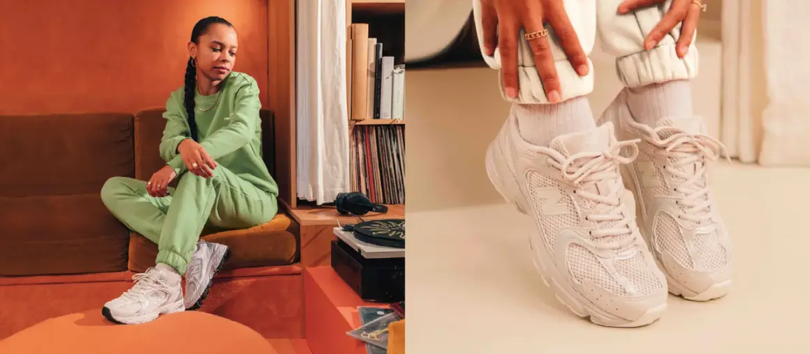 Donna con tuta verde e sneakers New Balance 530, un look casual e alla moda.