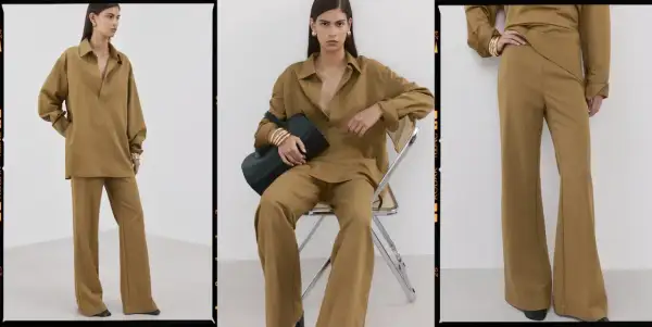 Modello indossa un completo color kaki, una tonalità calda e terrosa che ricorda la terra. La camicia oversize e i pantaloni a zampa creano un look elegante e rilassato.