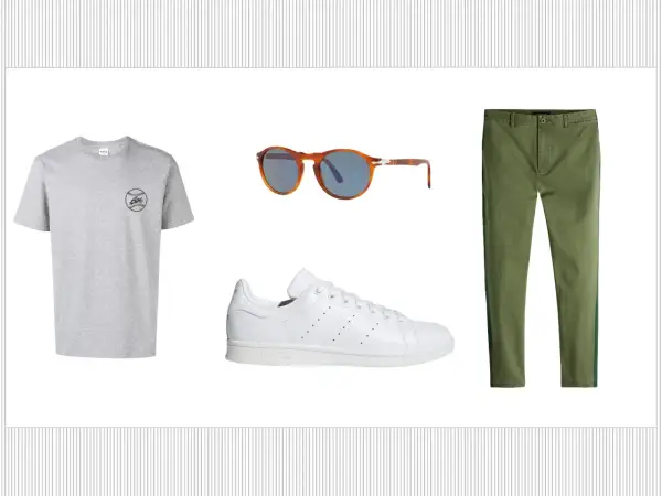 Outfit con t-shirt grigia, occhiali da sole tartarugati, pantaloni verdi e le iconiche Adidas Stan Smith, un classico intramontabile.
