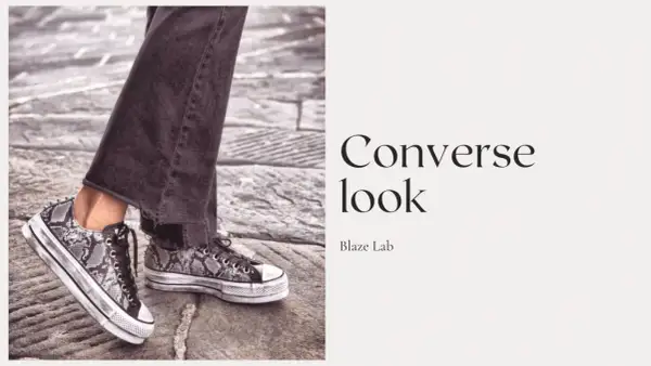 Un outfit con Converse uomo: jeans scuri e sneakers con stampa pitonata e plateau.