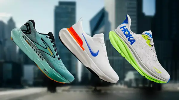 Scarpe da corsa Brooks, Nike e Hoka, marche di scarpe famose, in primo piano su uno sfondo urbano sfocato.